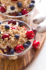 Food. Fruit salad with cherries, blueberry, muesli, yogurt