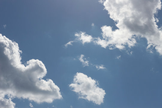 Summer sunny sky with cumulus clouds.
