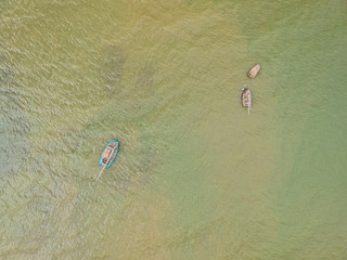 aerial view of small wooden boats in the sea