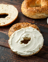 Bagels sandwich with cream cheese on wooden table