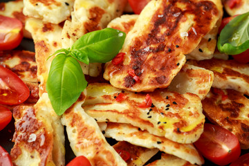 Pan-seared halloumi cheese and sweet cherry tomatoes salad