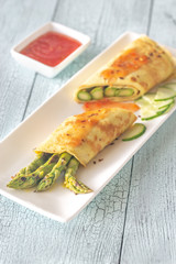 Coconut crepes with grilled asparagus