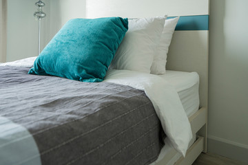 Bed maid-up with clean white pillows and bed sheets in beauty bedroom. Close-up. interior background