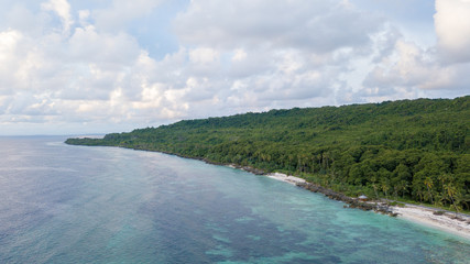 Aerial view of the beach and hills with nice sky and blue ocean in Wakatobi, Indonesia, Asia