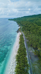 Aerial view of the beach near highway with nice sky and blue ocean in Wakatobi, Indonesia, Asia