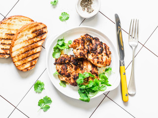 Mustard honey marinated bbq chicken fillet on light background, top view