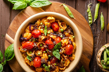 Corn paste with roasted tomatoes and fresh peas and onion
