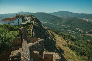 Fototapeta na wymiar Old houses and church on top of ridge with wall at the Marvao Castle