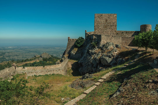 Walls and towers over rocky hill with garden at the Marvao Castle