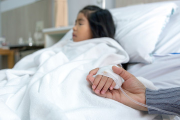 parent hold patient kid to give encouragement and injection