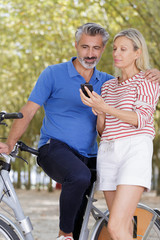 mature couple taking selfie outdoors