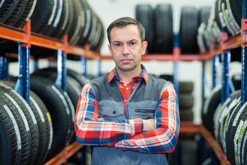 portrait of male tyre mechanic