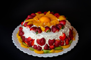 Sweet cream cake with fruits.