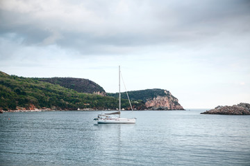 Fototapeta na wymiar Sailboat or sailing boat in the sea near the coast.