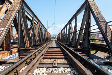 Fototapeta na wymiar Old Weathered Rusty Railway Bridge Above River Nišava