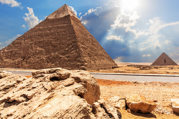 The Pyramid of Chephren, the Pyramid of Menkaure, view from the road in the desert