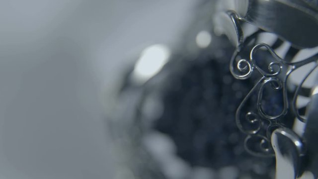Silver bracelet with a precious stone. macro photography