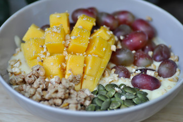 smoothie bowl, mango yogurt with fruit topping