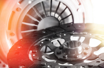 Close-up shot of clutch disk and basket on dark background