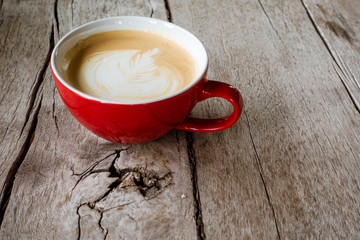 Hot latte art on wood desk