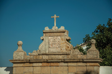 Obraz premium Cross over wall decorated in baroque style at Marvao