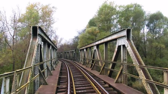 First person moving over train tracks