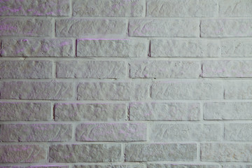 White brick wall texture background . Old white brick wall background texture close up . Image in light gray tonality . Unlimited endless seamless pattern of the white brick wall