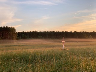 Fototapeta na wymiar Sunset over countryside in Minsk region of Belarus