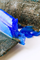 Patina and crystals of blue vitriol on copper plates anodes of galvanic installation close-up.
