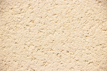 Beige painted grunge wall rough texture