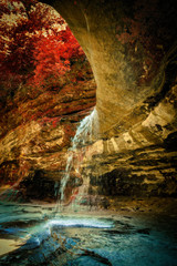 Naklejka na ściany i meble waterfall in the cave