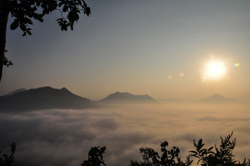 Mountains, trees, wind, sun, clouds