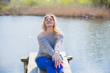 Pretty modern plus size lady lifestyle, woman&rsquo;s beauty. Female model with large size of figure posing outdoor