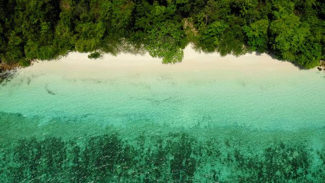 Aerial view from a drone of beautiful Nyaung Oo Phee island on sunny day in Myanmar