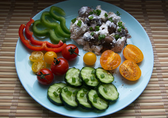 Mushrooms with chicken in cream sauce, tomatoes, cucumbers, pepper
