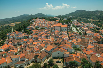 City landscape with old building roofs and church steeple