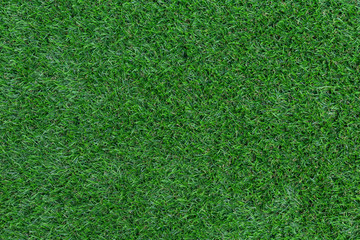 Obraz premium Green artificial grass pattern and texture for background.