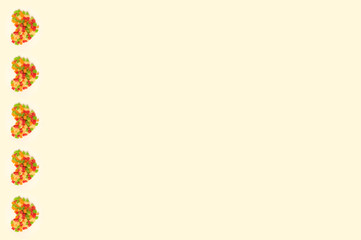 Pattern of thre sweet hearts made of colorful delicious candied fruits