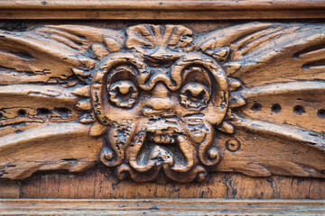 Medieval palace with carved wooden door.