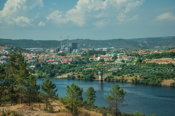 Fototapeta na wymiar Valley with the wide Tejo River and industry on horizon
