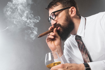 bearded man smoking cigar