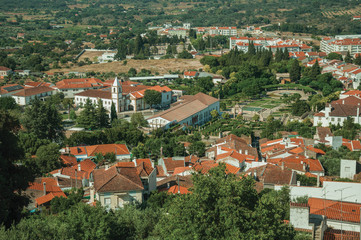 Fototapeta na wymiar City landscape with old building roofs and church steeple