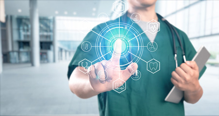 young doctor with hospital background