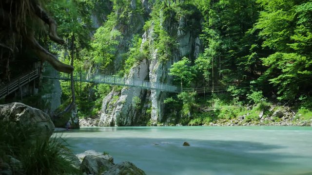 Beautiful suspension bridge in Austria, Klobenstein. Time lapse