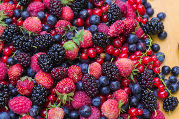 black berry red currant strawberries mulberry and raspberry berries for health background
