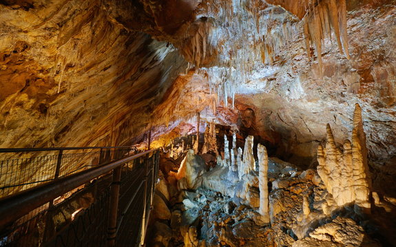 Stalactites and stalagmites with footbridge in the cave of the Grandes Canalettes, France, Pyrenees-Orientales, Villefranche de Conflent