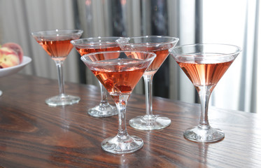 martini glasses of red cocktails