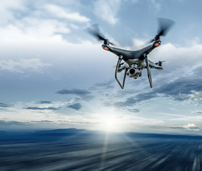 Dark drone in flight over the city.