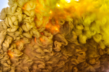 Ink in the water. A splash of pink and black paint. Abstract background