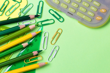 School supplies. Back to school concept on green background Top view Flat lay